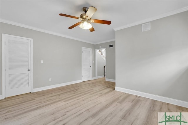 unfurnished room with ceiling fan, ornamental molding, and light hardwood / wood-style flooring