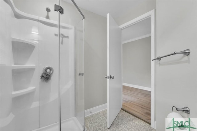 bathroom with a shower with shower door