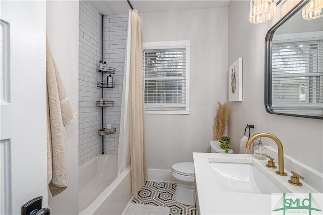 full bathroom featuring shower / bath combination with curtain, tile patterned floors, toilet, and sink