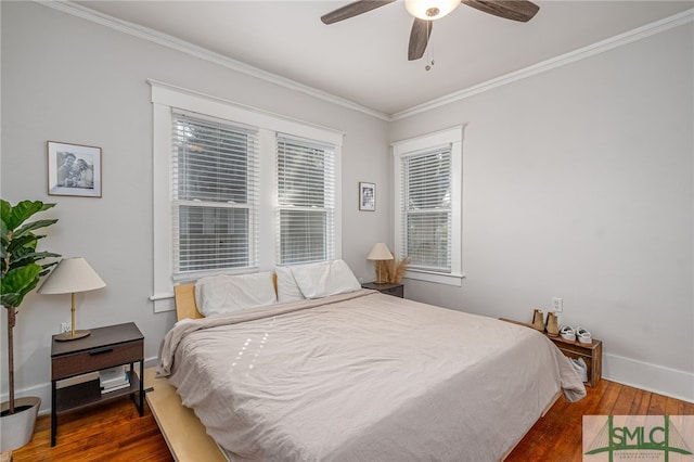 bedroom featuring crown molding, ceiling fan, and hardwood / wood-style floors