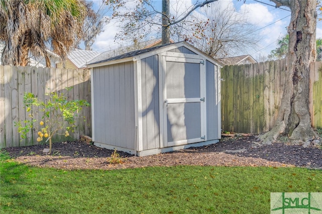 view of outbuilding featuring a yard