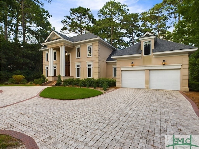 neoclassical home with a garage