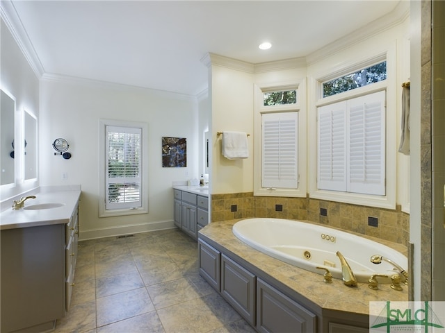 bathroom with crown molding, vanity, and a bathing tub