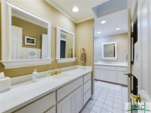 bathroom featuring tile patterned flooring, crown molding, and vanity