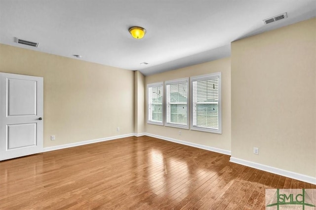 empty room featuring hardwood / wood-style flooring