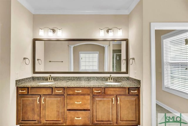 bathroom featuring vanity, an enclosed shower, and crown molding