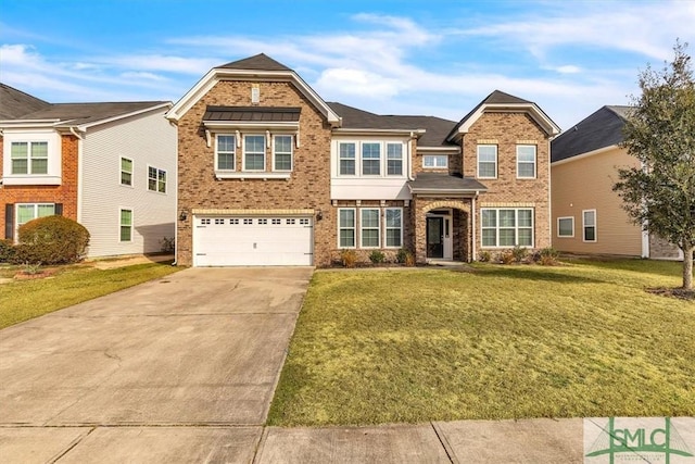 view of front of home with a garage and a front yard