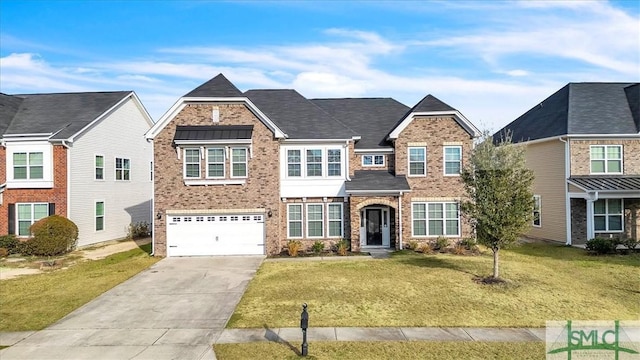 view of front of home with a garage and a front lawn