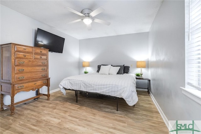 bedroom featuring ceiling fan and light hardwood / wood-style floors