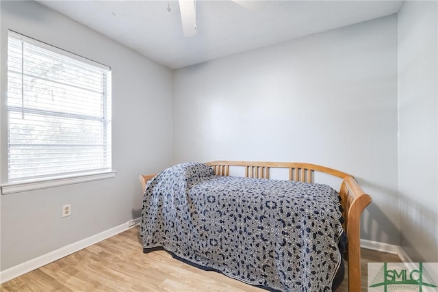 bedroom featuring ceiling fan and hardwood / wood-style floors