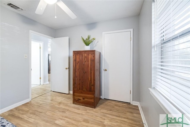 unfurnished room with ceiling fan and light hardwood / wood-style floors