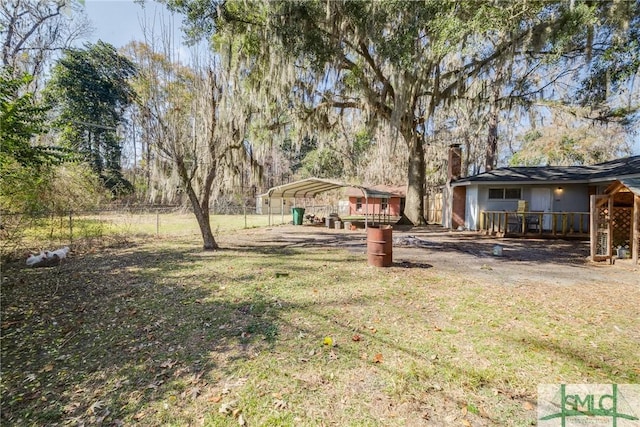 view of yard featuring a carport