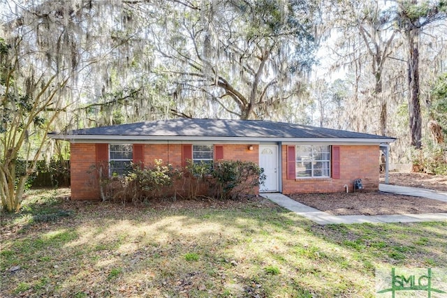 ranch-style house with a front lawn