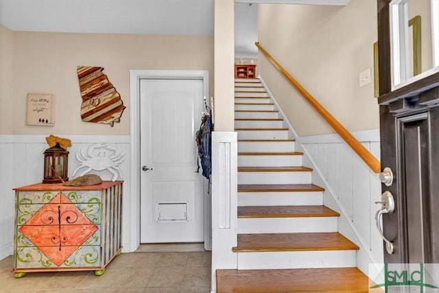 staircase with tile patterned flooring