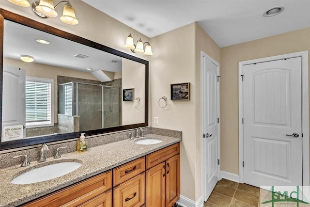 bathroom featuring walk in shower, vanity, and tile patterned flooring