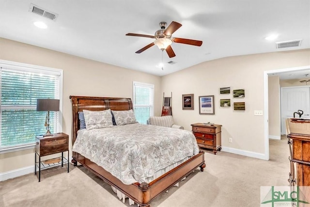 bedroom with lofted ceiling, light carpet, and ceiling fan