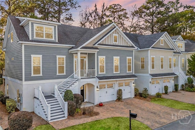 22 Dockside Dr, Savannah, GA 31410 - view of front of home featuring stairs, a garage, decorative driveway, and roof with shingles