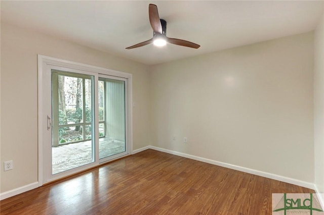 spare room with ceiling fan and hardwood / wood-style floors