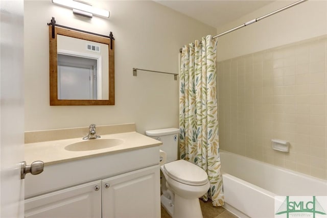 full bathroom with vanity, shower / tub combo, and toilet