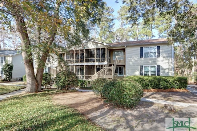 view of front of property with a sunroom