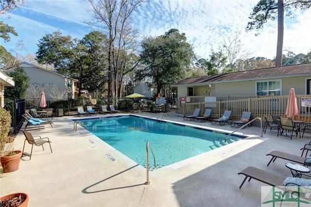 view of swimming pool with a patio area