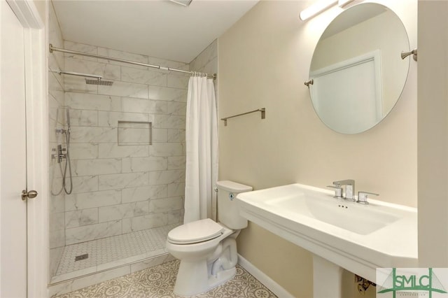 bathroom with curtained shower and toilet