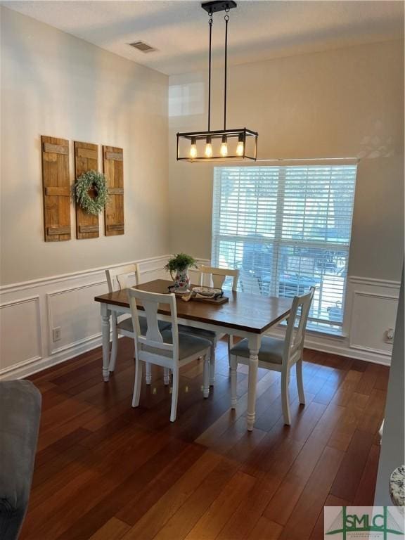 dining area featuring dark hardwood / wood-style flooring