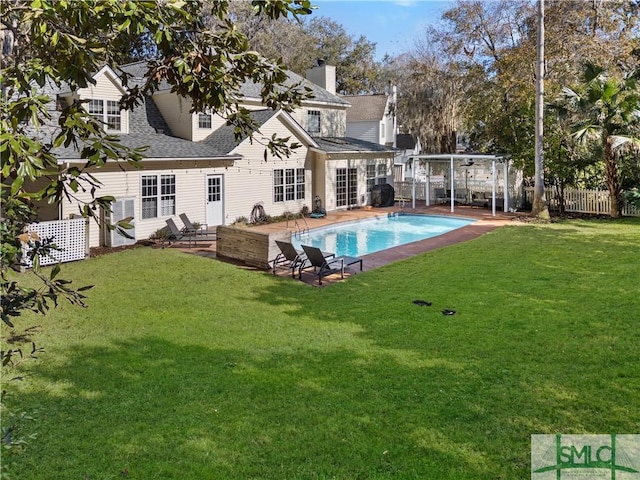 back of property featuring a yard and a patio