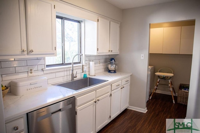 kitchen featuring sink, white cabinets, dark hardwood / wood-style flooring, decorative backsplash, and stainless steel dishwasher