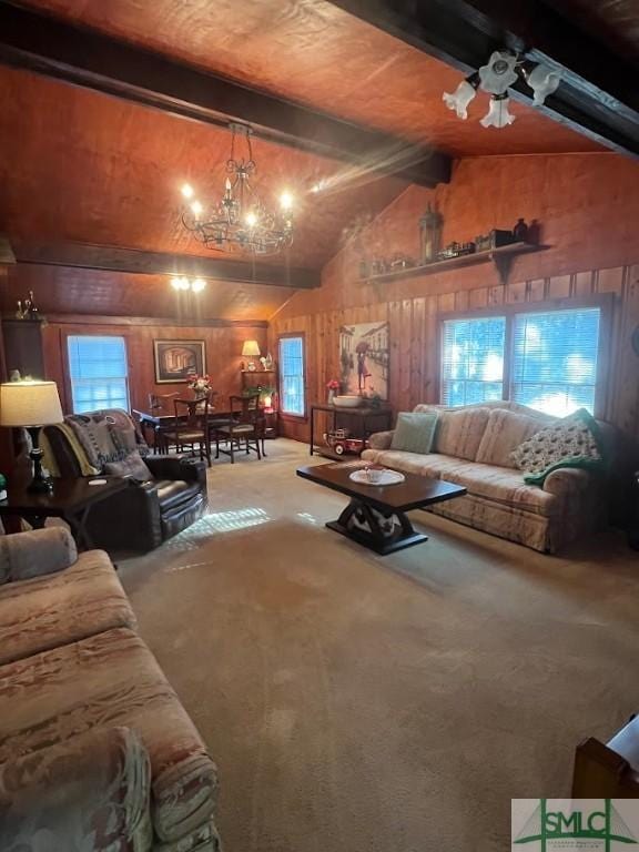 living room featuring ceiling fan with notable chandelier, wood walls, beamed ceiling, and carpet flooring