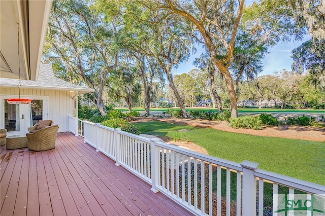 wooden deck with a yard