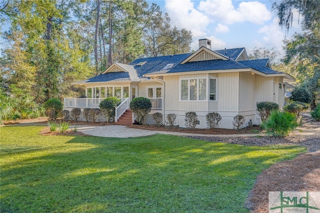 ranch-style home featuring a front yard