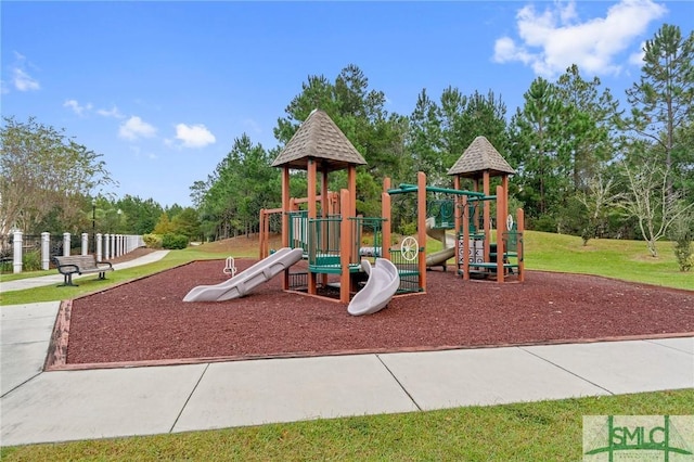 view of jungle gym featuring a lawn