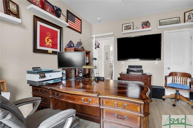 office area with light hardwood / wood-style floors