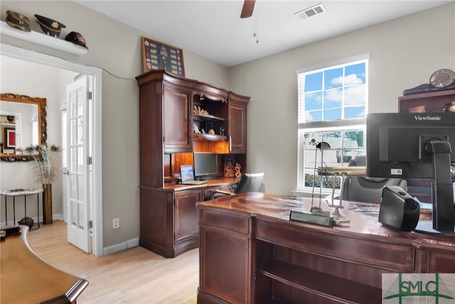 office area with light hardwood / wood-style floors and ceiling fan