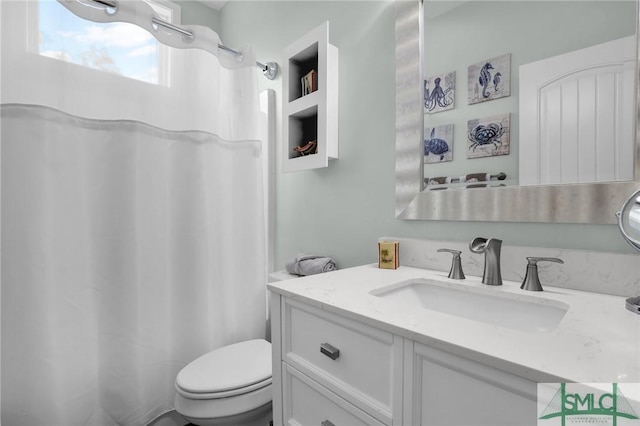 bathroom featuring vanity and toilet