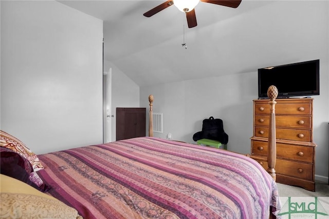 bedroom featuring lofted ceiling, light carpet, and ceiling fan