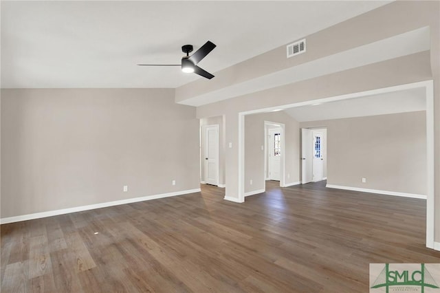 unfurnished living room with dark wood-type flooring, ceiling fan, and lofted ceiling