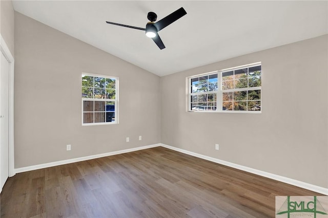 unfurnished bedroom featuring lofted ceiling, hardwood / wood-style flooring, and ceiling fan