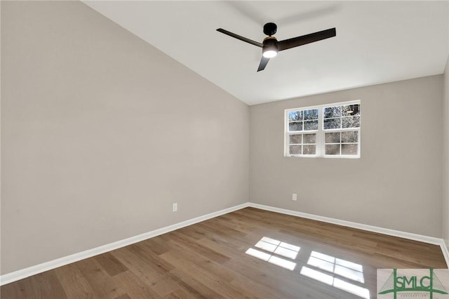 empty room with wood-type flooring, vaulted ceiling, and ceiling fan