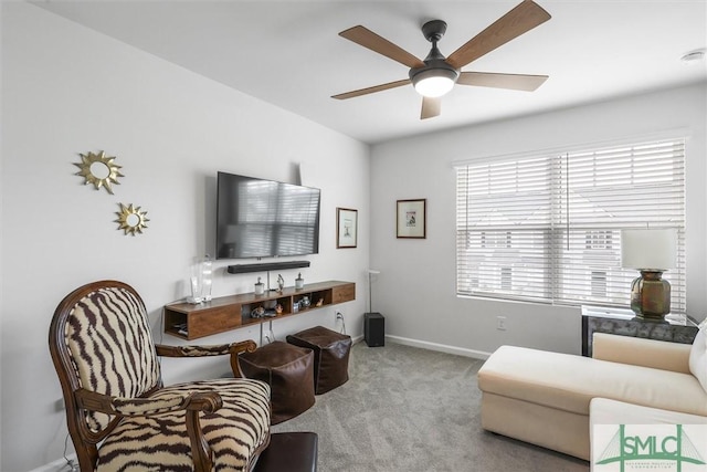 living room featuring light carpet and ceiling fan