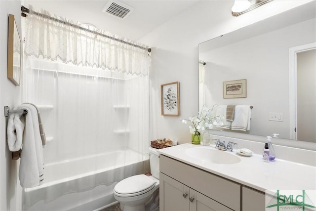 full bathroom with vanity, bathing tub / shower combination, and toilet