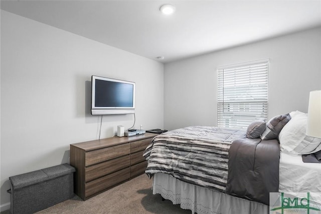 bedroom with light colored carpet