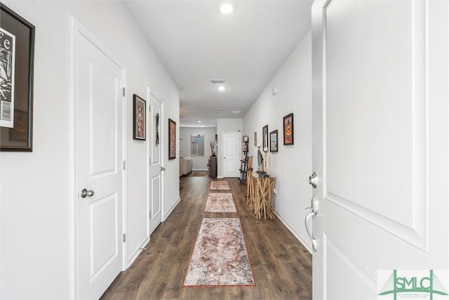 hallway featuring dark wood-type flooring