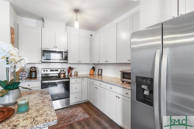 kitchen with stainless steel appliances and white cabinetry