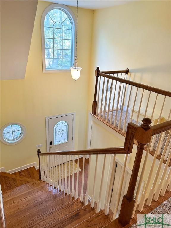 stairway with wood finished floors