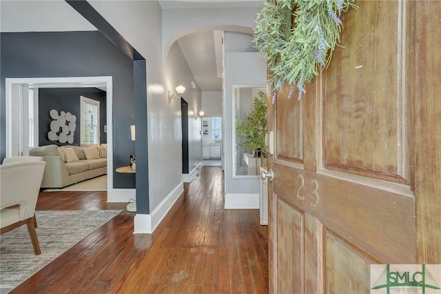 entryway with dark wood-type flooring