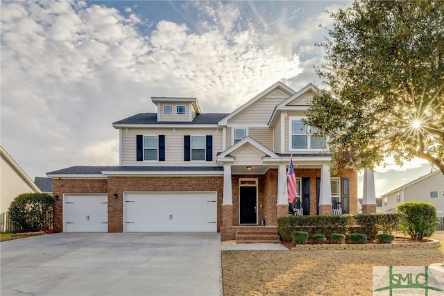 craftsman-style home with a garage and covered porch