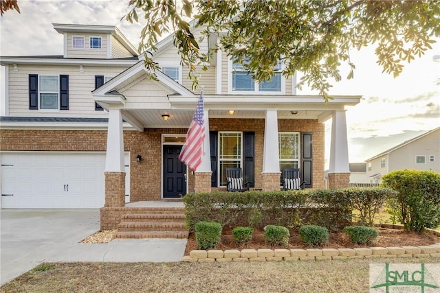 craftsman-style house with a garage and a porch