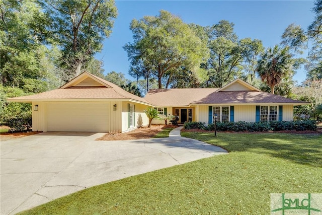 ranch-style house with a garage and a front yard